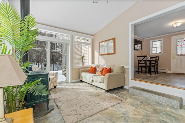 living room with a baseboard heating unit, vaulted ceiling, and ornamental molding