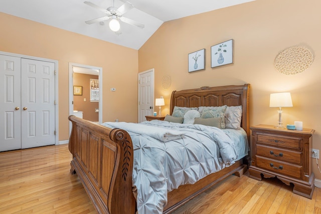 bedroom with ceiling fan, light hardwood / wood-style floors, vaulted ceiling, and a closet