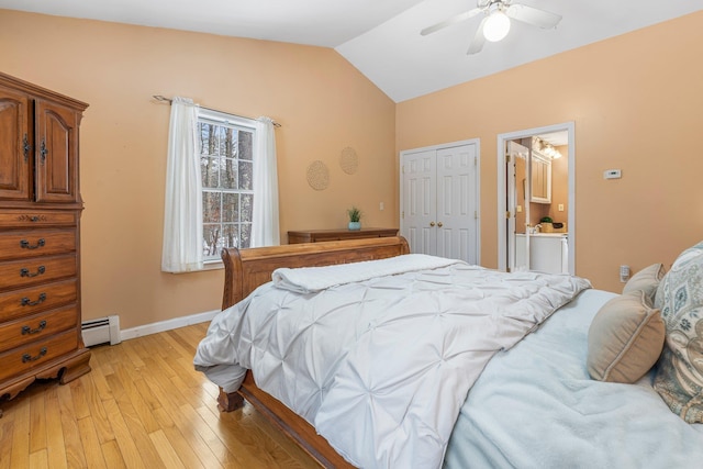 bedroom with vaulted ceiling, baseboard heating, a closet, ceiling fan, and light hardwood / wood-style floors