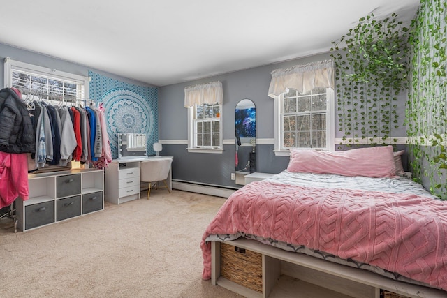 carpeted bedroom with a baseboard radiator