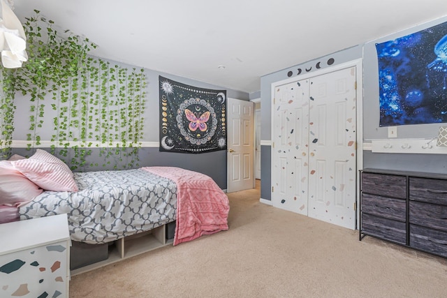 carpeted bedroom featuring a closet