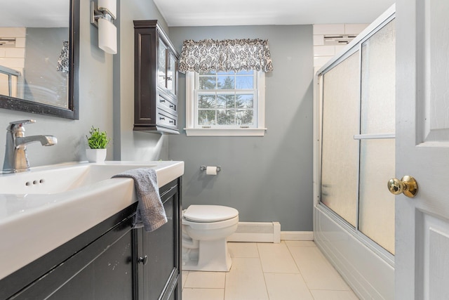 full bathroom featuring tile patterned floors, toilet, bath / shower combo with glass door, vanity, and a baseboard heating unit