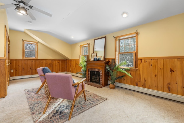 interior space featuring lofted ceiling, a wealth of natural light, and baseboard heating