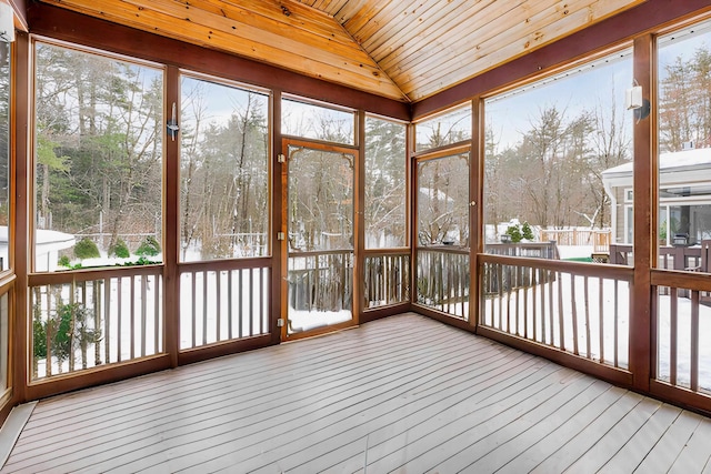 unfurnished sunroom with lofted ceiling and wood ceiling