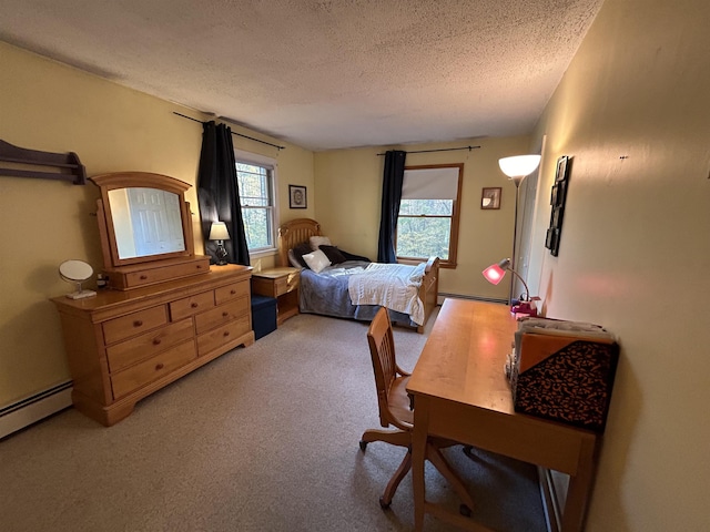 carpeted bedroom featuring multiple windows, a baseboard heating unit, and a textured ceiling