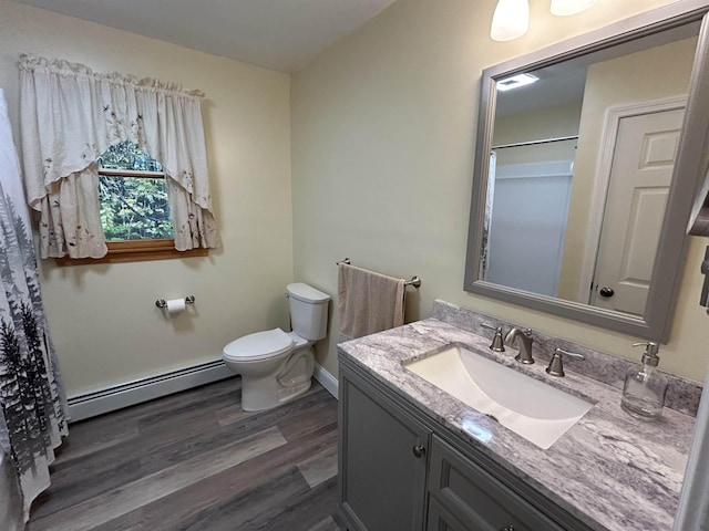 bathroom with baseboard heating, vanity, wood-type flooring, a shower with curtain, and toilet