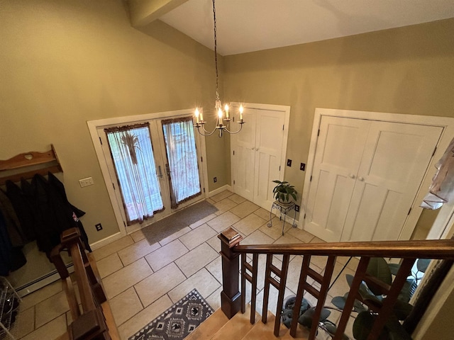 tiled foyer with an inviting chandelier, beam ceiling, high vaulted ceiling, and french doors