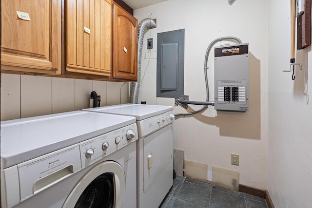 washroom with cabinets, separate washer and dryer, and electric panel