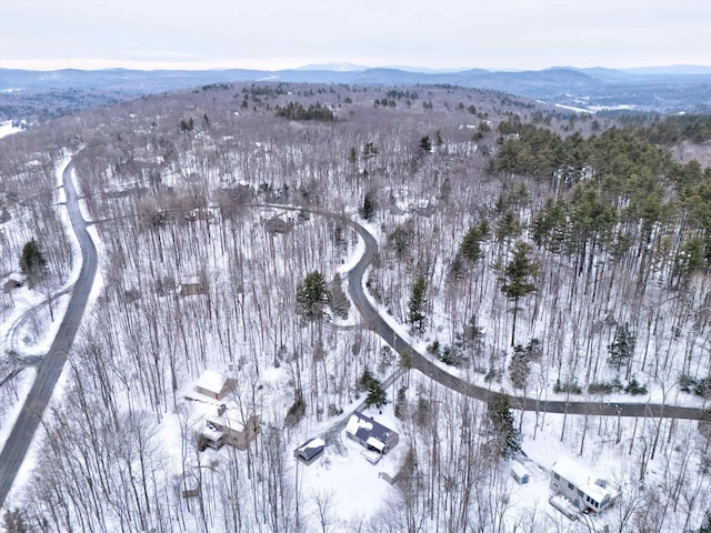 snowy aerial view featuring a mountain view