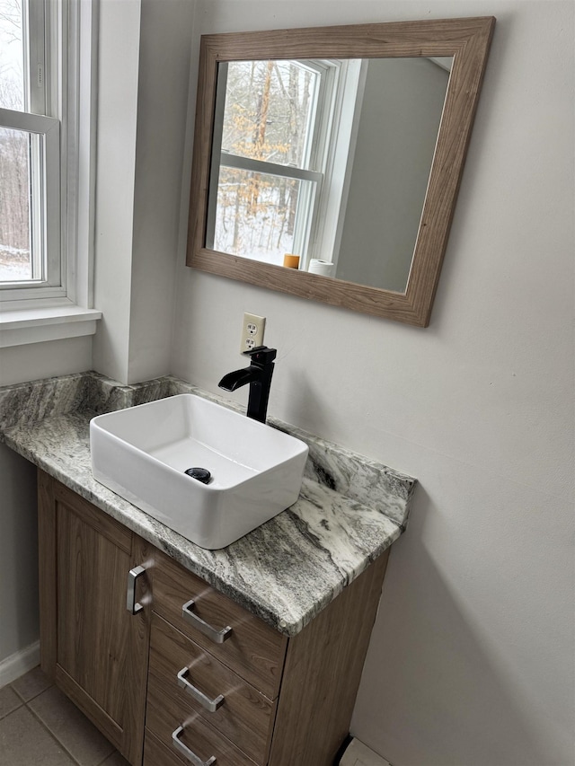 bathroom with vanity and tile patterned floors