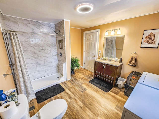 bathroom featuring vanity, hardwood / wood-style floors, toilet, and a shower with shower curtain