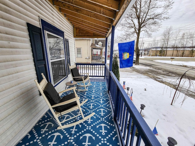 view of snow covered deck