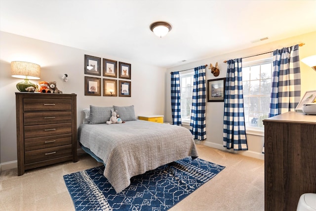 bedroom with light colored carpet