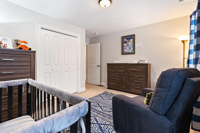 carpeted bedroom featuring a closet