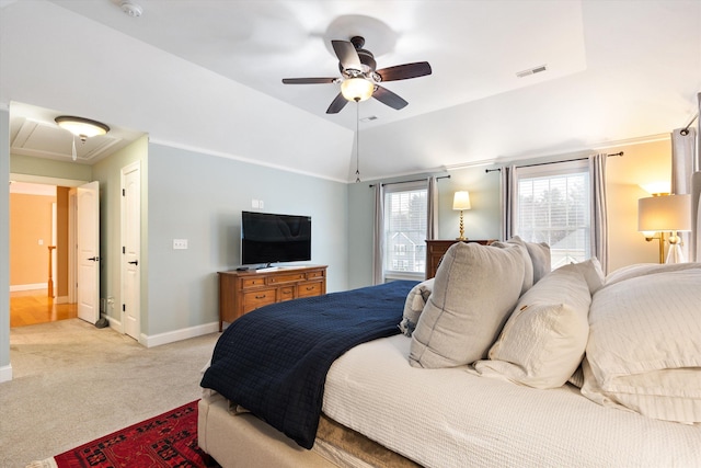 bedroom featuring vaulted ceiling, light carpet, and ceiling fan