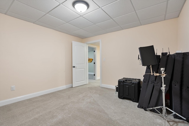 miscellaneous room featuring light carpet and a drop ceiling