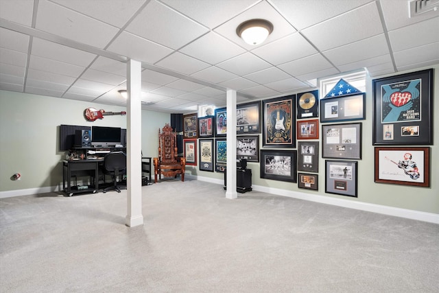 basement with carpet and a drop ceiling