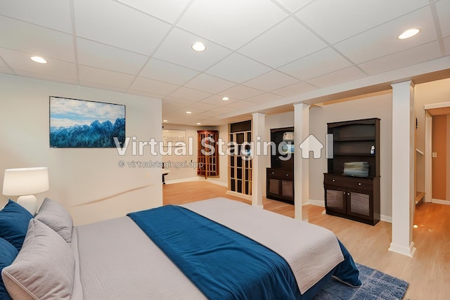 359 Winding Pond Rd Unit 359, Londonderry, NH 03053 - bedroom with a paneled ceiling, recessed lighting, baseboards, and light wood-style flooring