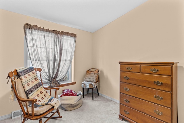 sitting room with light colored carpet