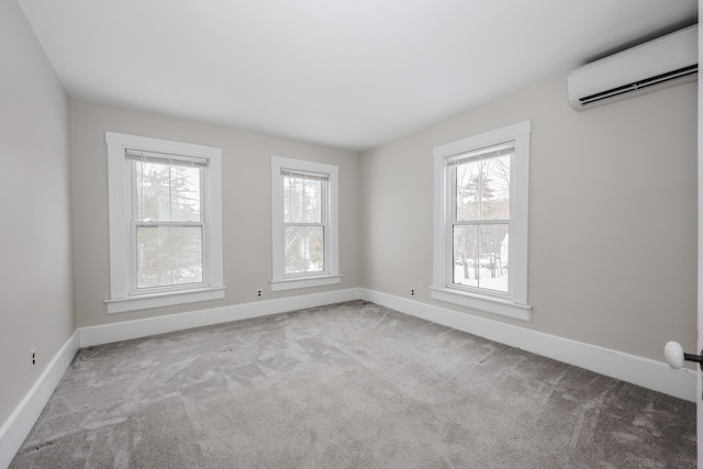 unfurnished room featuring light carpet and a wall unit AC