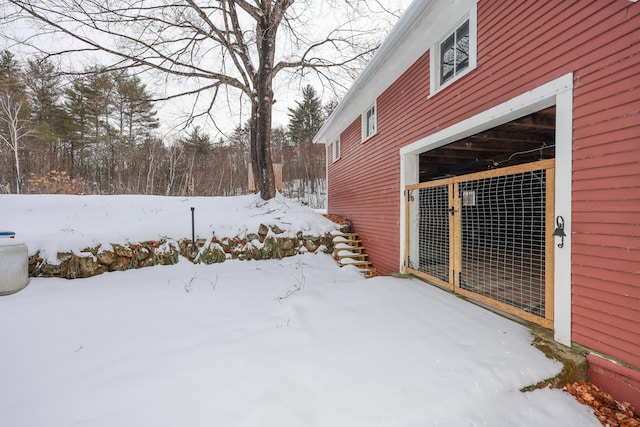 yard covered in snow featuring an outdoor structure