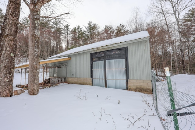 view of snow covered garage