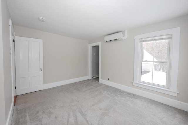 carpeted empty room featuring a wall mounted AC