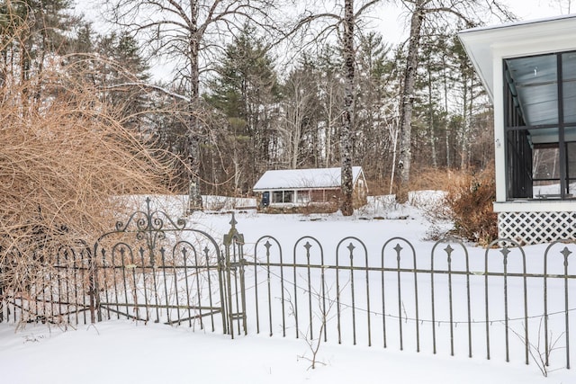 view of snow covered gate