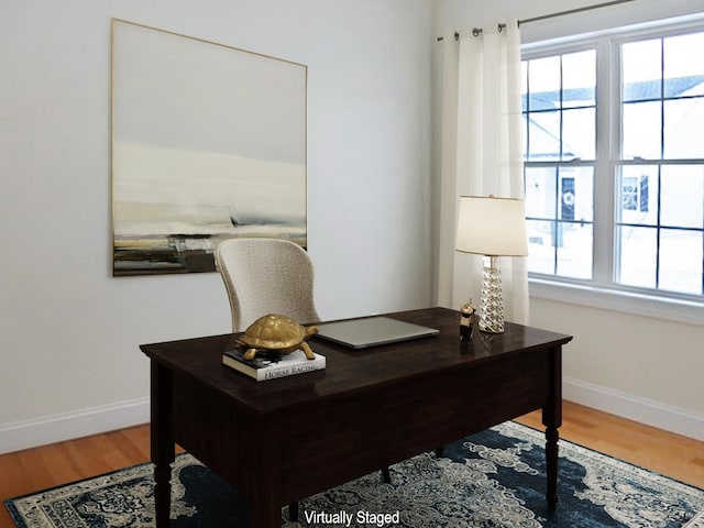 home office featuring hardwood / wood-style floors and a healthy amount of sunlight