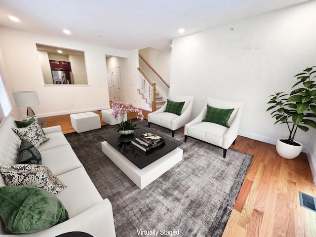 living room with dark hardwood / wood-style floors