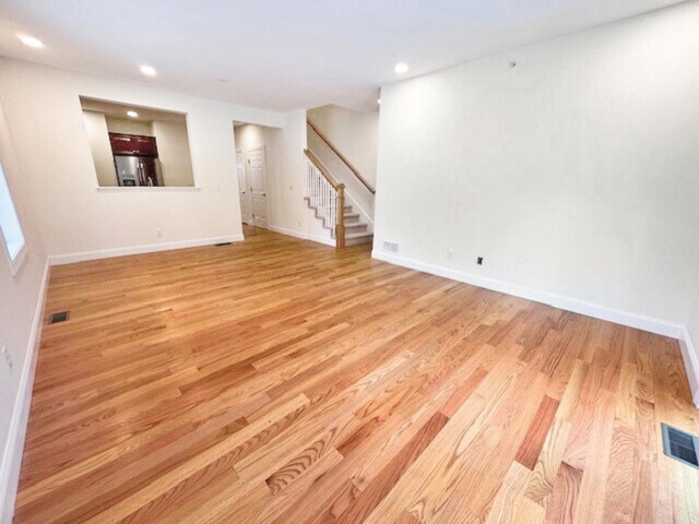 unfurnished living room with light hardwood / wood-style floors