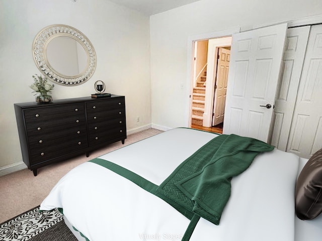 bedroom with light carpet and a closet