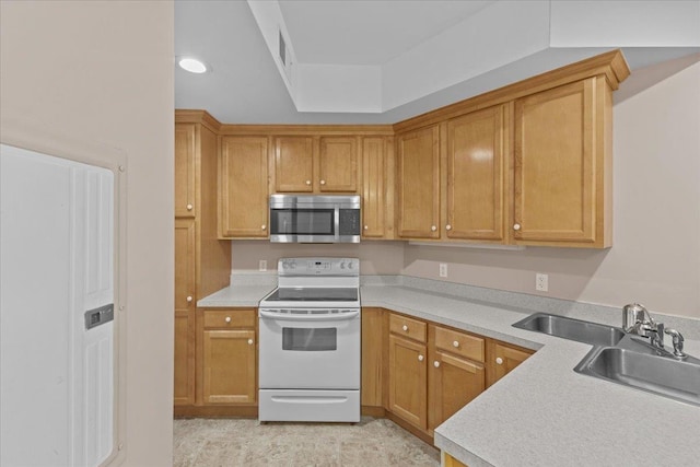 kitchen with sink and white range with electric stovetop