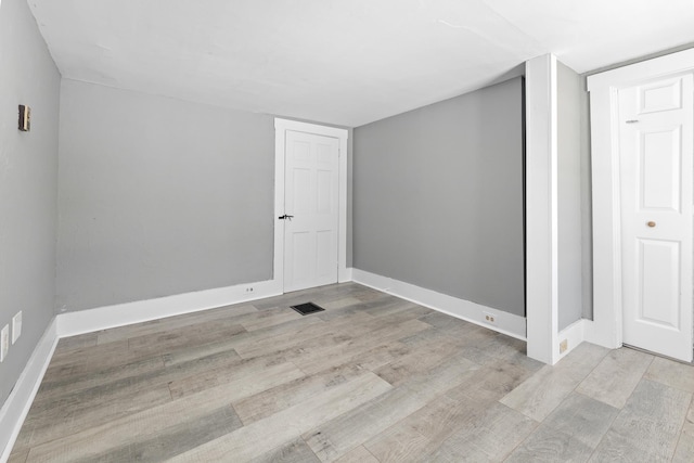 unfurnished room featuring light wood-type flooring