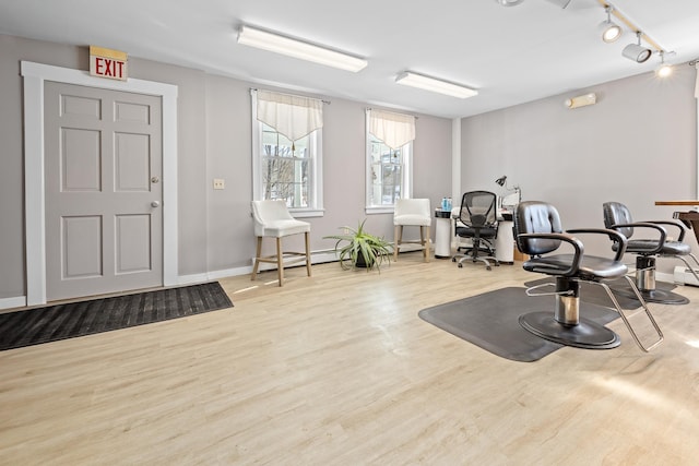 exercise area featuring light wood-type flooring