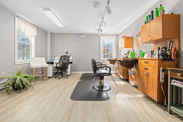 kitchen with track lighting and light hardwood / wood-style floors