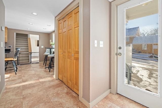 hallway featuring a wealth of natural light