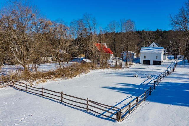 view of yard layered in snow