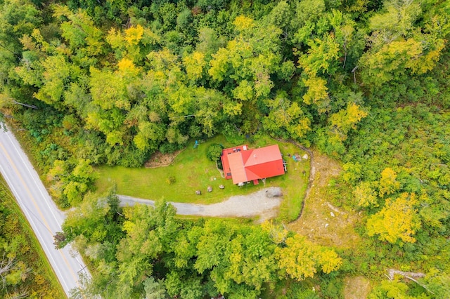 drone / aerial view featuring a view of trees