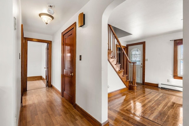 entrance foyer featuring hardwood / wood-style floors and baseboard heating