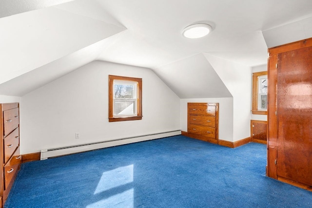 bonus room with lofted ceiling, a baseboard heating unit, and carpet flooring