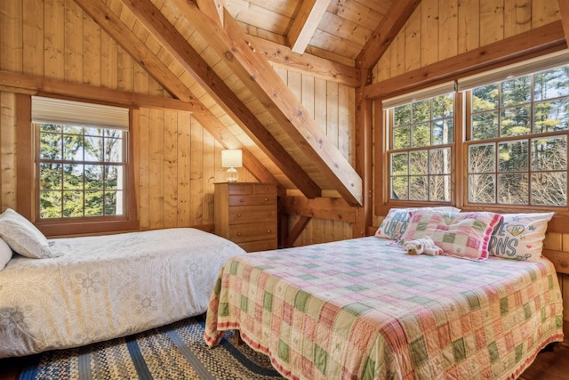 bedroom featuring lofted ceiling with beams and wood walls