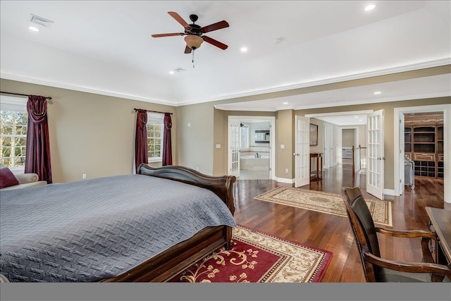 bedroom with multiple windows, crown molding, dark hardwood / wood-style floors, and french doors