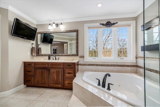 bathroom with tile patterned flooring, crown molding, a relaxing tiled tub, and vanity