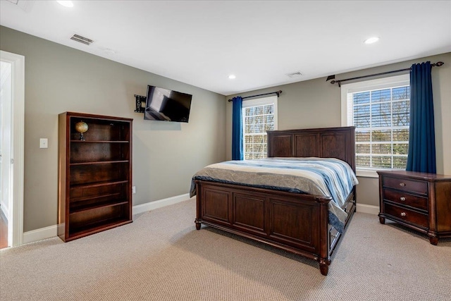 bedroom featuring light carpet