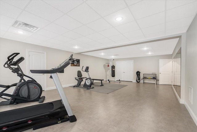 workout room with a drop ceiling