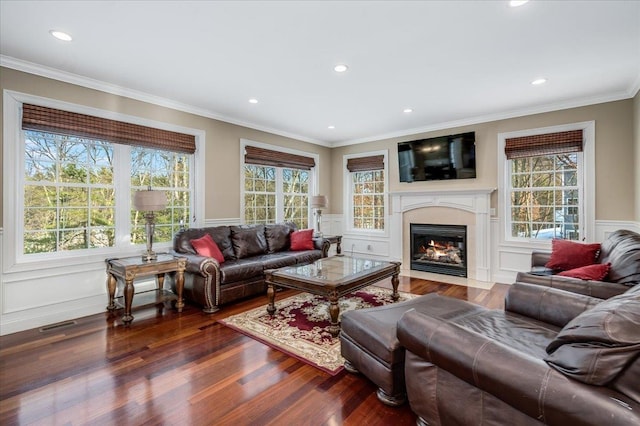 living room featuring ornamental molding and wood-type flooring