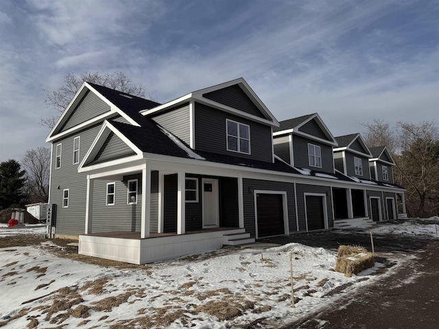 view of front of house with a porch and a garage