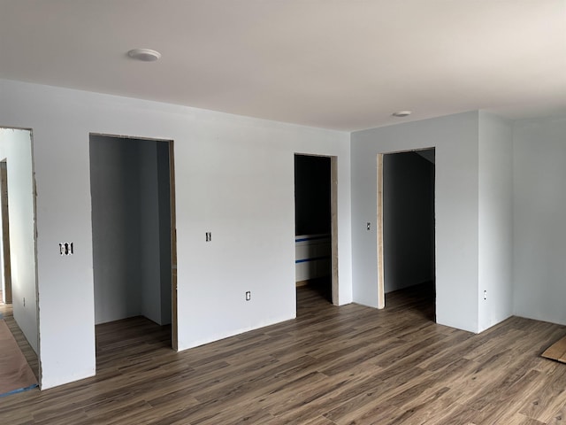 spare room featuring wood finished floors