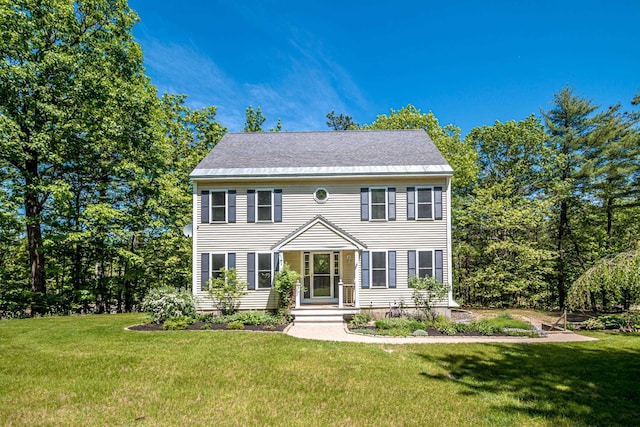 colonial-style house with a front lawn